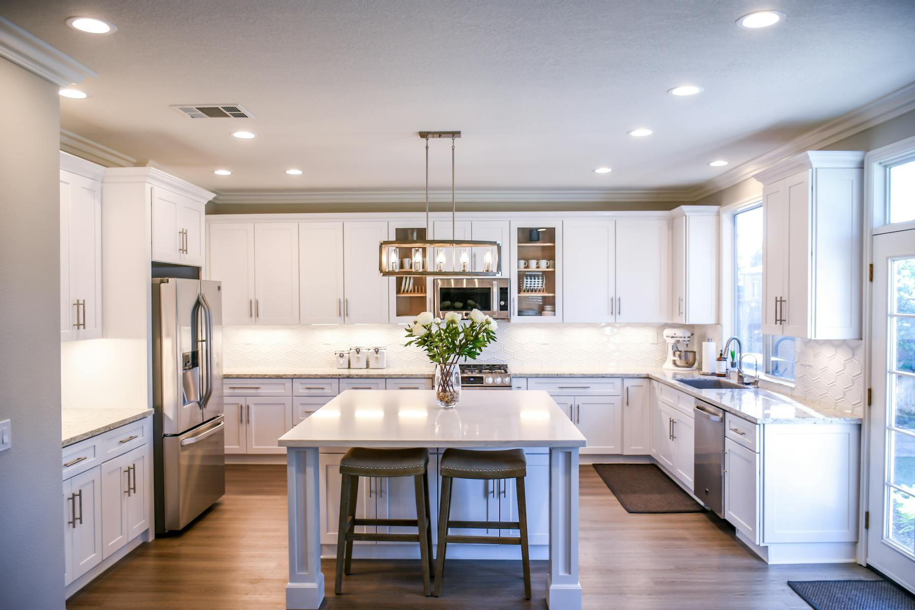 Contemporary real kitchen with cabinet runs and stone counters